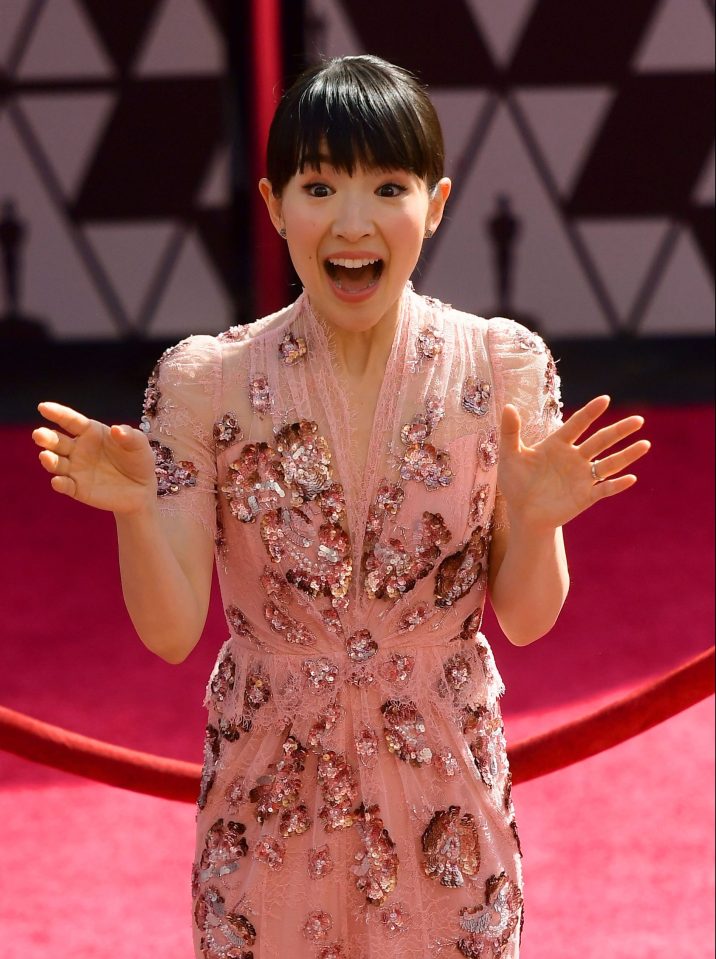  Marie stunned in a pink, v-neck Jenny Packham full-length dress made from delicate lace