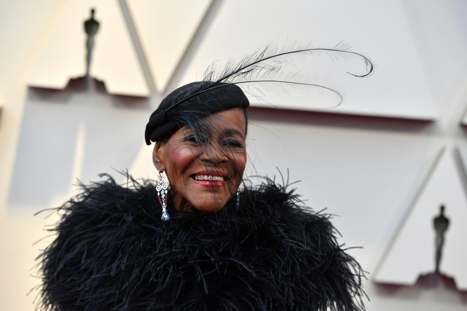  The unmissable outfit came with a hat and, you've guessed it, more feathers