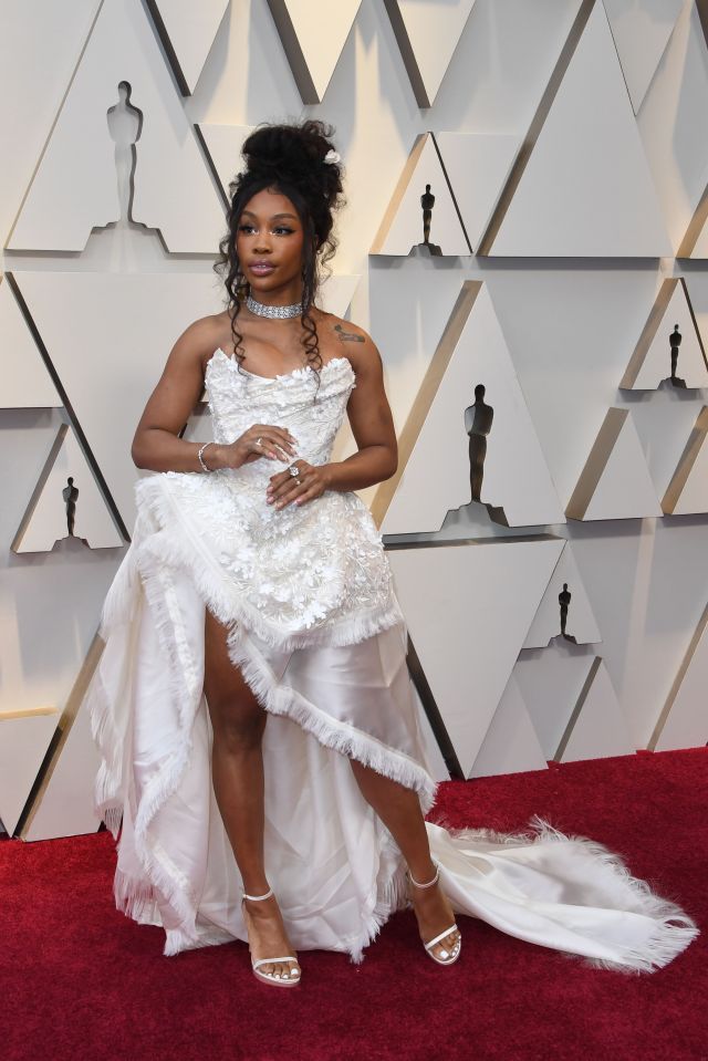  Singer SZA, 28, also went for a sheer skirt and thigh high slit