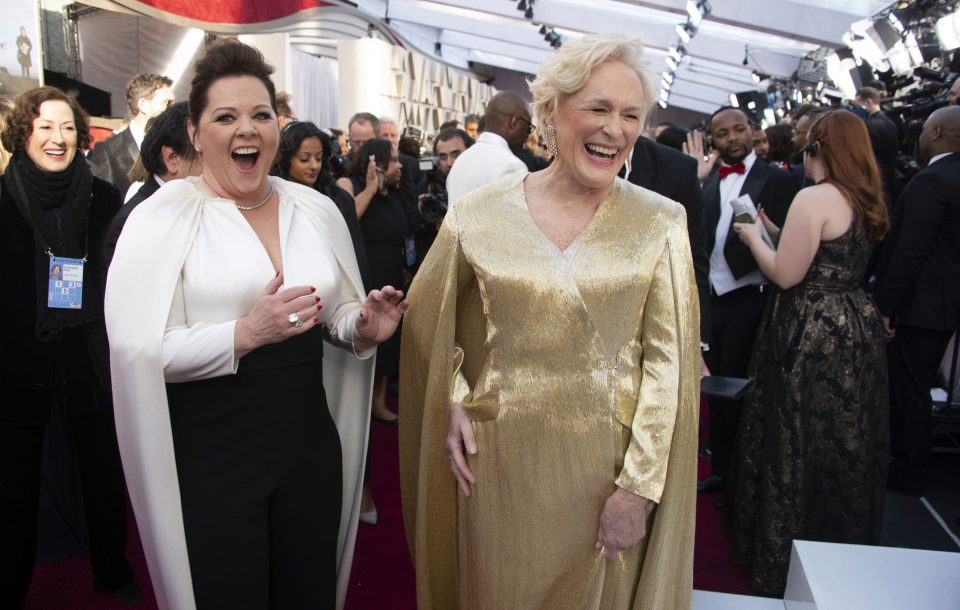  Despite her heavy burden of a dress, Glenn found time to joke with Melissa McCarthy, who is also up for the same award