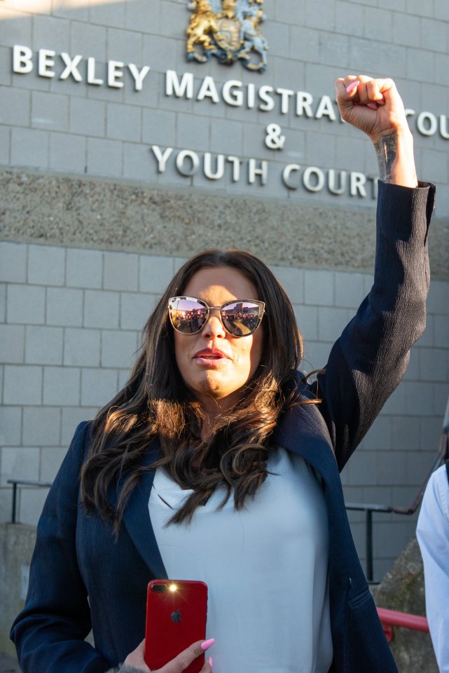 Katie Price punched the air as she left court after escaping with a driving ban and fine
