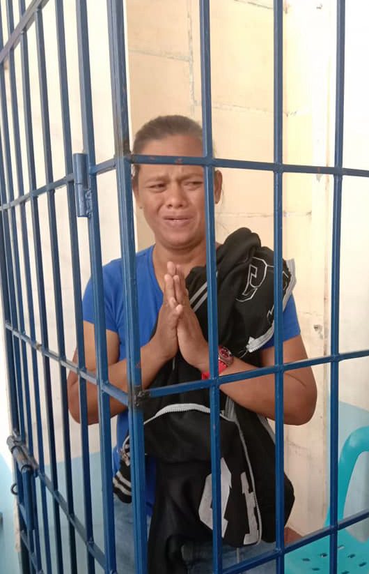 Lilibeth Bustamante, pictured behind bars, was detained after being caught trying to walk away with a ten-year-old girl in Paranaque City