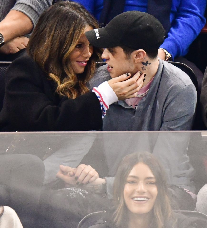  The couple put on a cosy display and didn't care who saw as they watched the New York Rangers