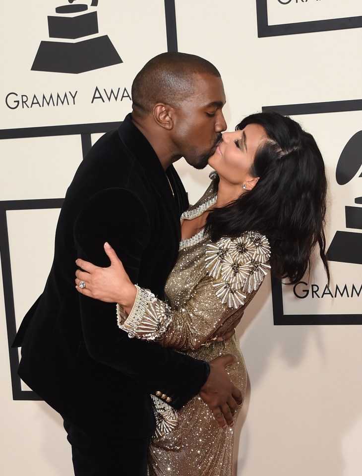  Kim Kardashian looks like she's swerving a kiss from husband Kanye West on the red carpet in 2015