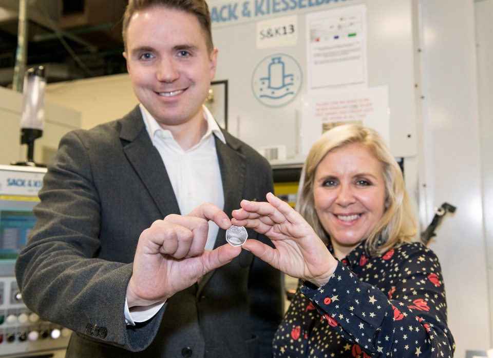  Hawking's son and daughter, Tim and Lucy, visited the Royal Mint for the unveiling