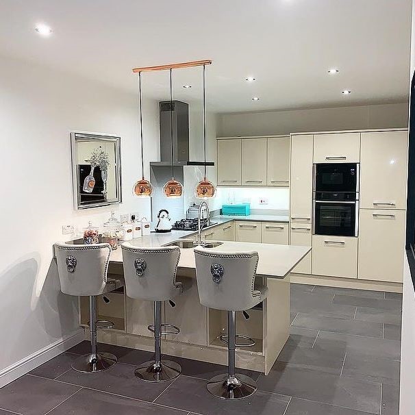  The white and silver theme starts in the newly built kitchen