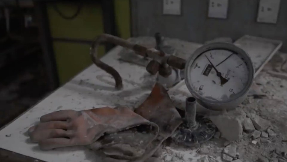 A worker's glove is caked in dust that has settled in the years since his last shift ended 