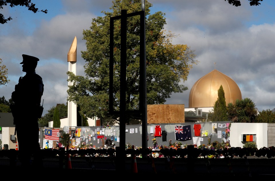  A police officer stands guard outside Al Noor mosque in Christchurch