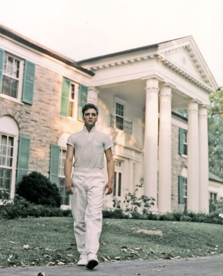The King strolls the grounds of his Graceland estate circa 1957
