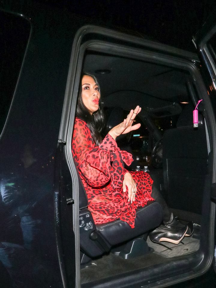  She pouted as she climbed into the back of a car