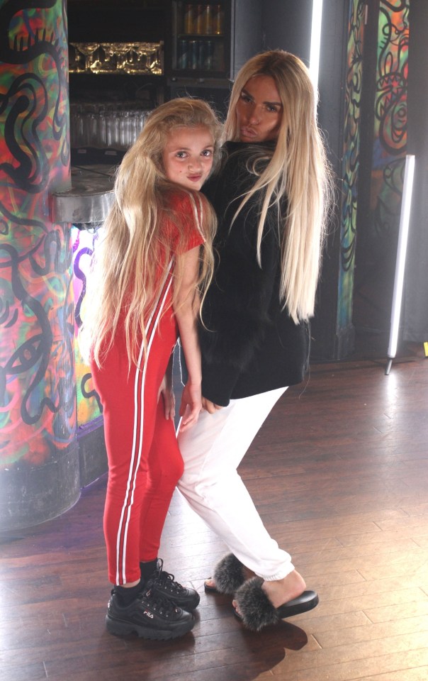  Katie struck a pose with Princess after she strutted down the catwalk