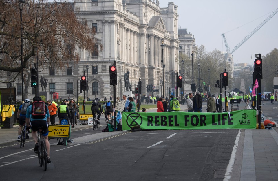 Roads empty of cars as Extinction Rebellion campaigners occupy Parliament Square in London on a fourth day of protests