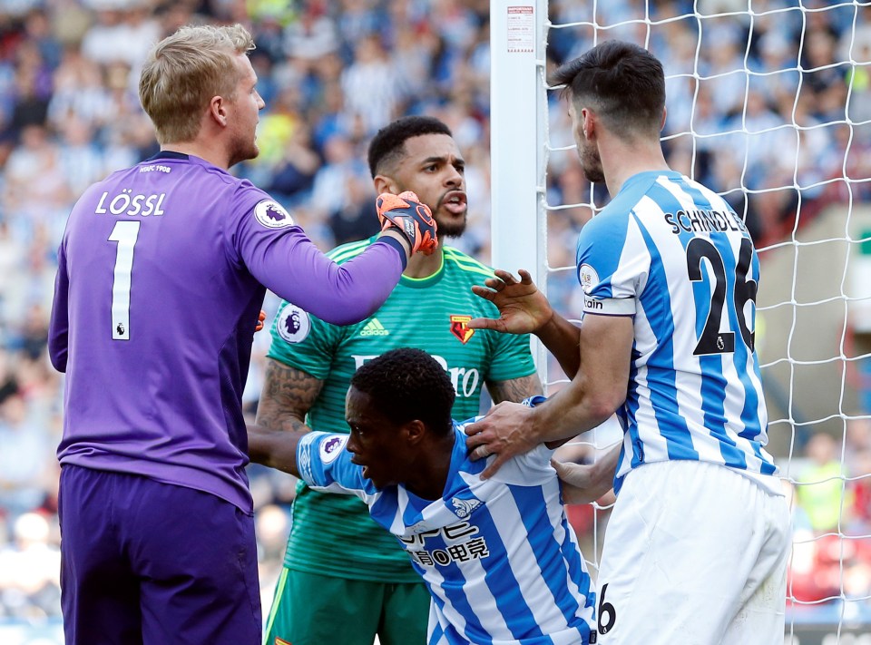  Andre Gray confronts the Huddersfield defence