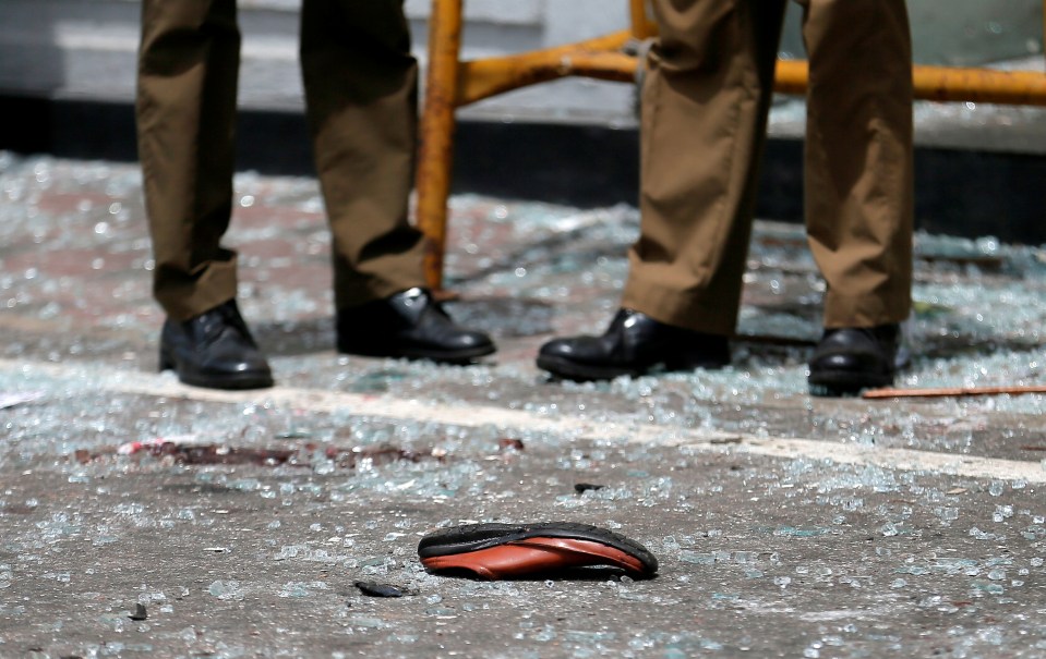  A shoe is pictured in the street among shattered glass following the attacks in Sri Lanka
