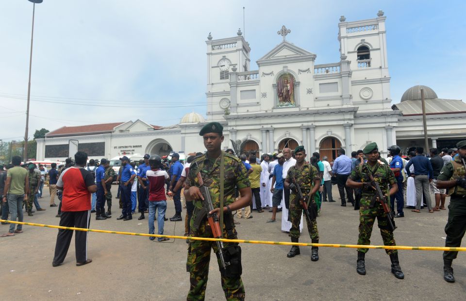 Sri Lankan security personnel keep watch outside the church premises