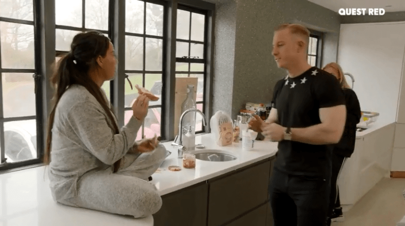  He takes the toast from her