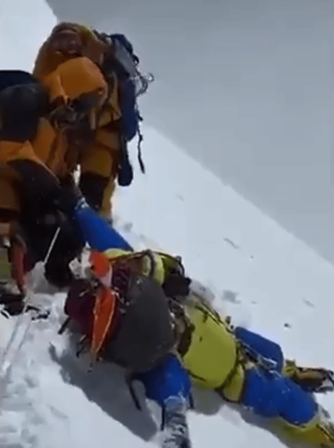  Sherpas desperately held her so she wouldn't fall, however she collapsed and died