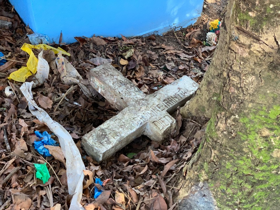  A cross marks the spot where they were buried