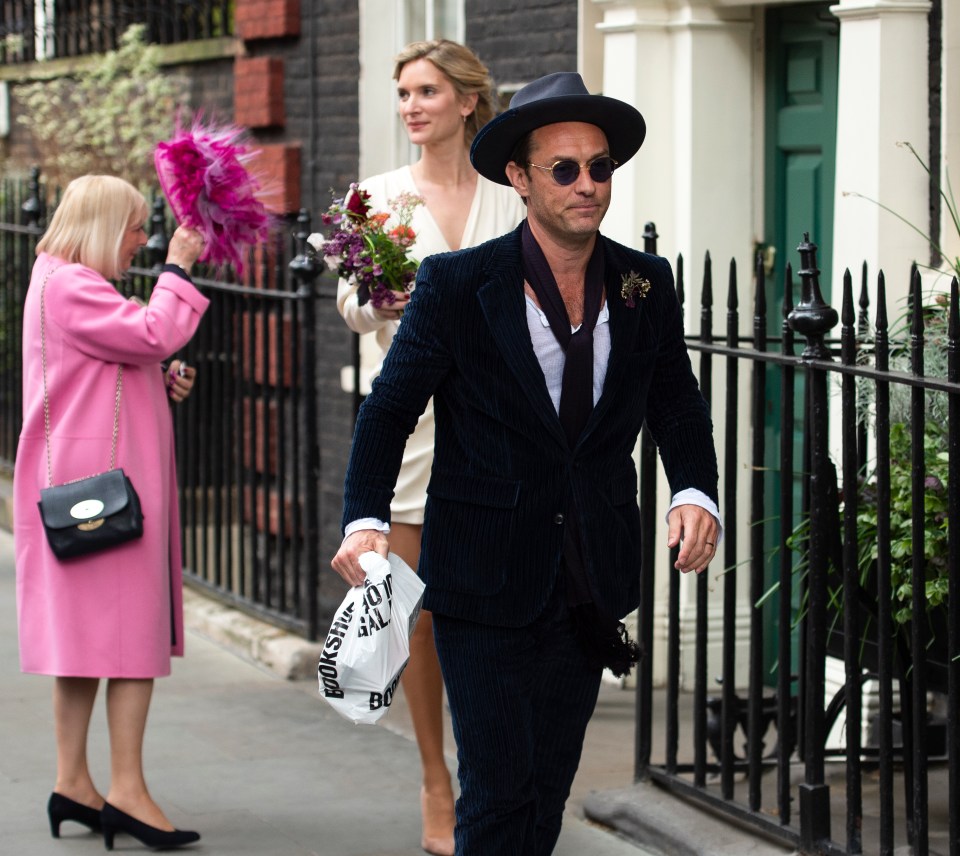Jude Law looked very dapper in a blue corduroy suit for his wedding