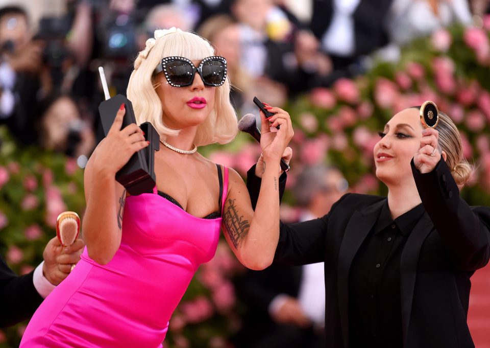  The billowing dress was then unbuttoned