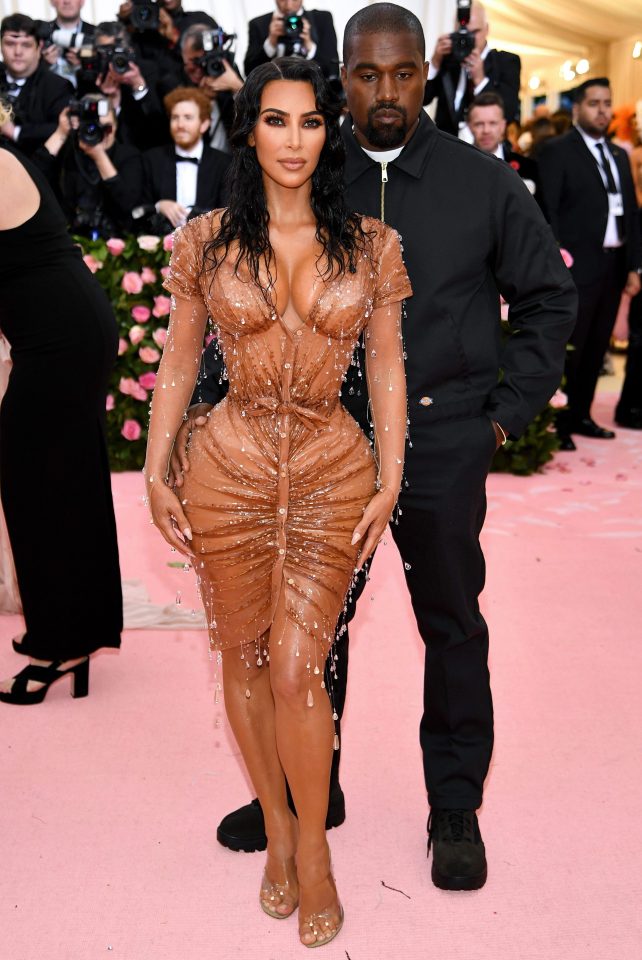  Kim Kardashian showed off her mind-boggling curves alongside husband Kanye West