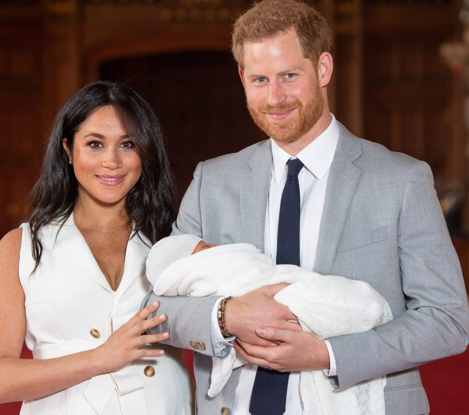  Meghan Markle and Prince Harry pose with newborn son Archie