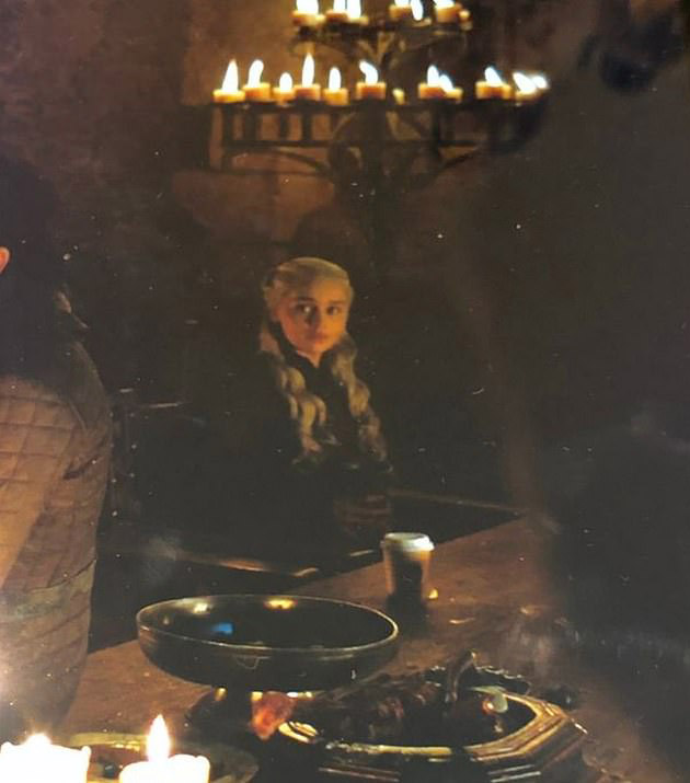  A Starbucks coffee cup can be seen during the medieval banquet