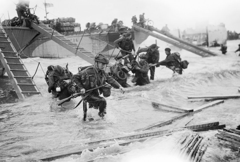 Royal Marine Commandos come ashore at Juno Beach on the morning of D-Day, June 6, 1944