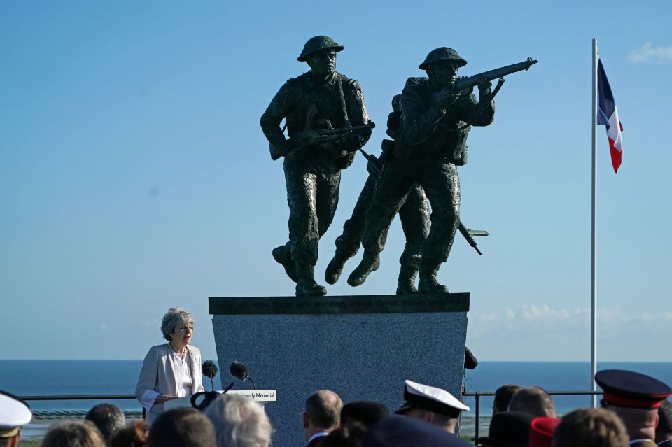  A stunning blue sky was the backdrop to Mrs May's speech - alongside the new memorial which will mark Britain's contribution