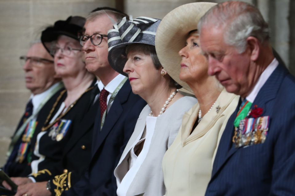  Mrs May at the second of her day's events to mark D-Day in France along with Philip, Charles and Camilla