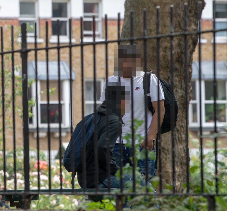 The man stood appeared to be operating with two other males wearing rucksacks