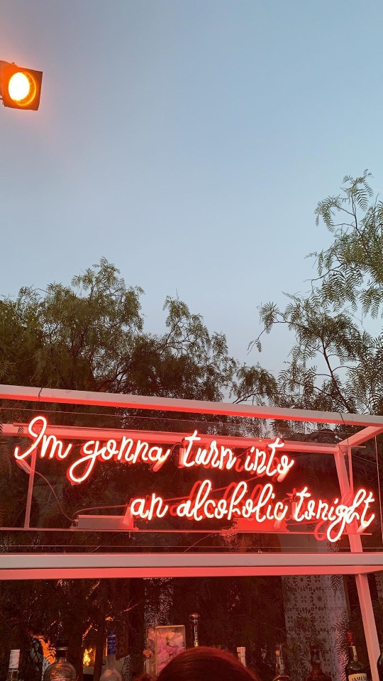  A Vegas-style neon sign welcomed party-goers to the bar on the warm Californian evening