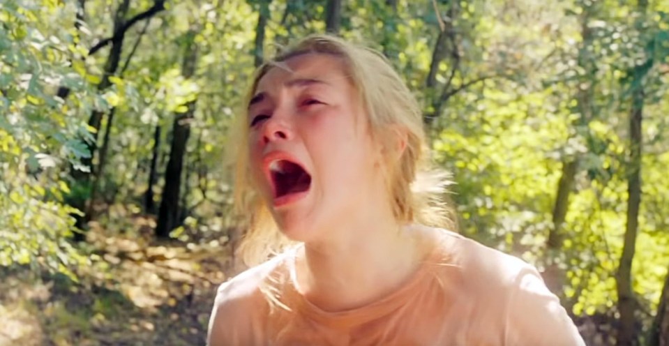  Dani, played by Florence Pugh, is seen running for her life