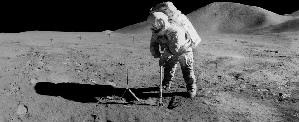  Panorama view of Apollo 15 lunar module pilot James B. Irwin, using a scoop in making a trench in the lunar soil during the second moonwalk of the mission