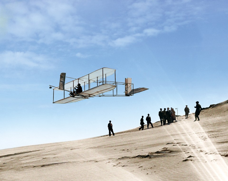  A colourised image of the first aeroplane flight, completed by the Wright Brothers in 1903