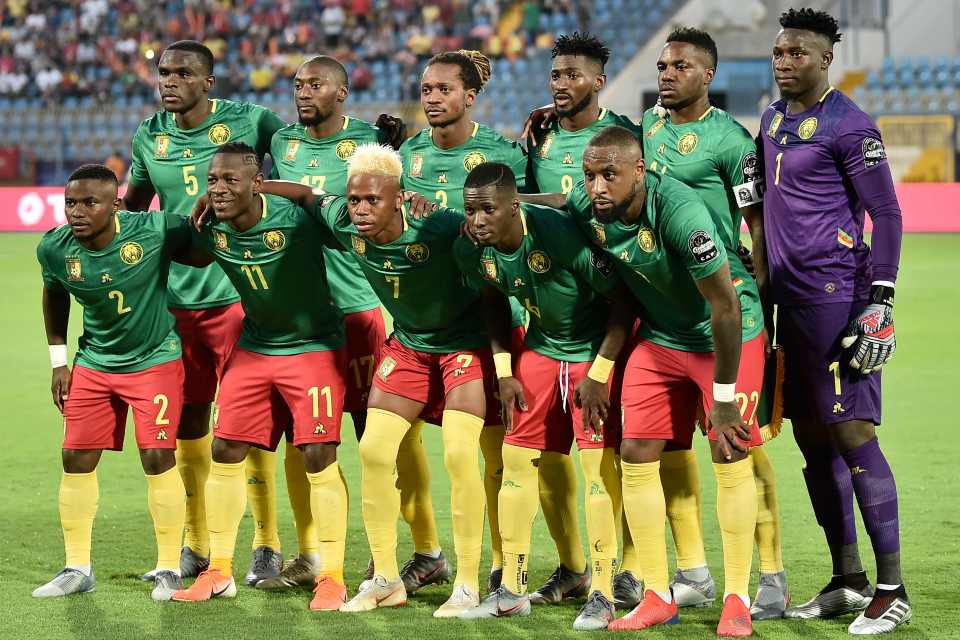  Cameroon kick-off the game topping Group F