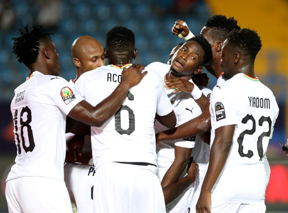 Ghana's Thomas celebrates scoring their second goal with team mates