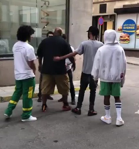 One the clip the star's huge minder is seen repeatedly telling the men to go away
