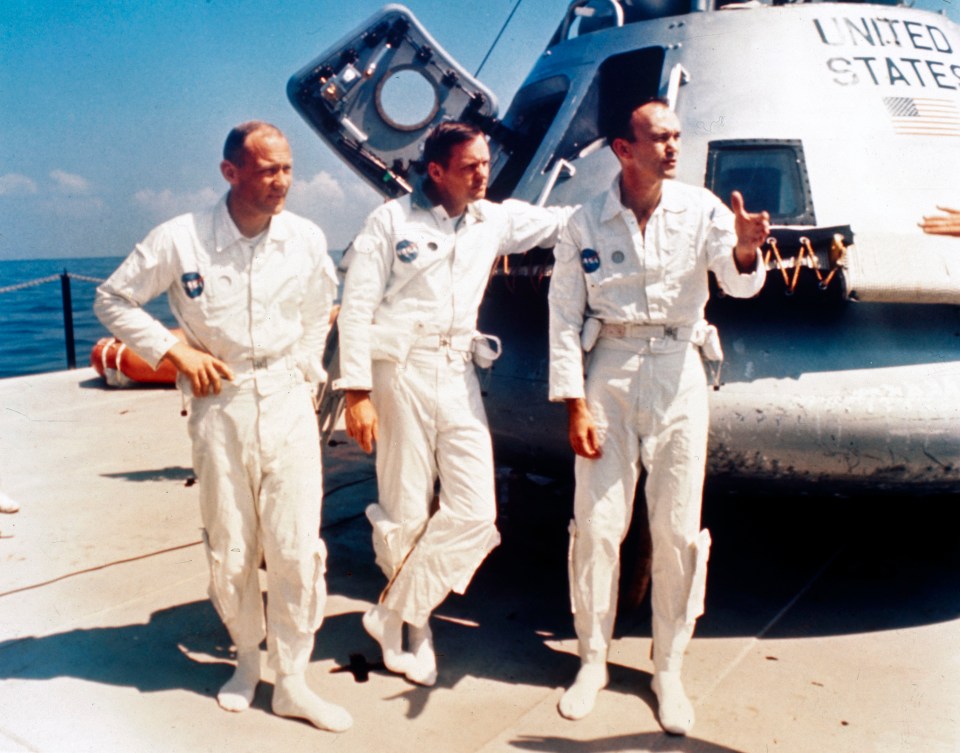 Neil Armstrong, Michael Collins and Buzz Aldrin on the deck of the NASA vessel Retriever