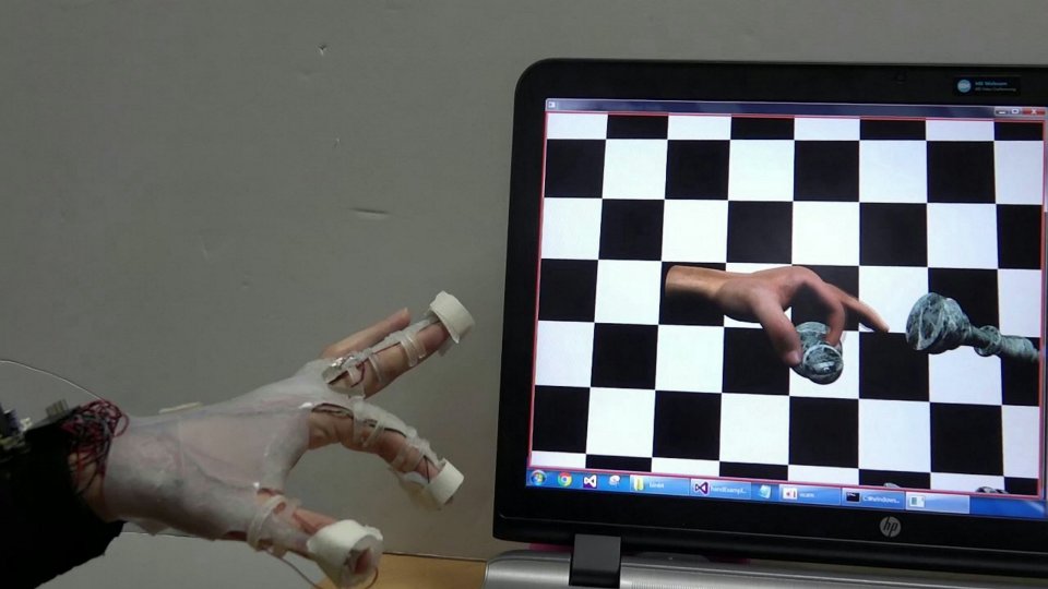  The glove was tested on a virtual chess board program where users successfully picked up the digital chess pieces
