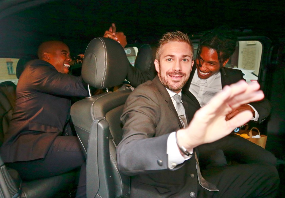 A$AP Rocky high-fives his pal as he leaves the district court in Sweden today