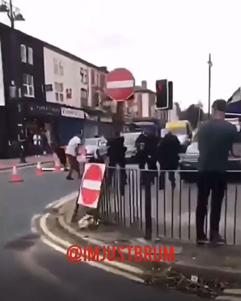  Chaos broke out on the street as police rushed to arrest a man suspected of trying to run down an officer
