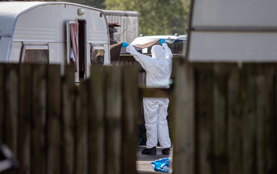  Forensics officers at work at the Four Houses Corner caravan site near Reading