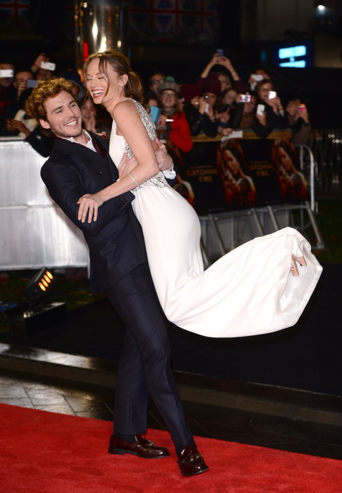  Sam picks up Laura at the UK Premiere of The Hunger Games: Catching Fire in Leicester Square in 2013