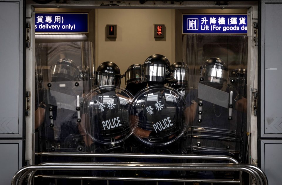 Cops in riot gear try to control protesters during unrest last month