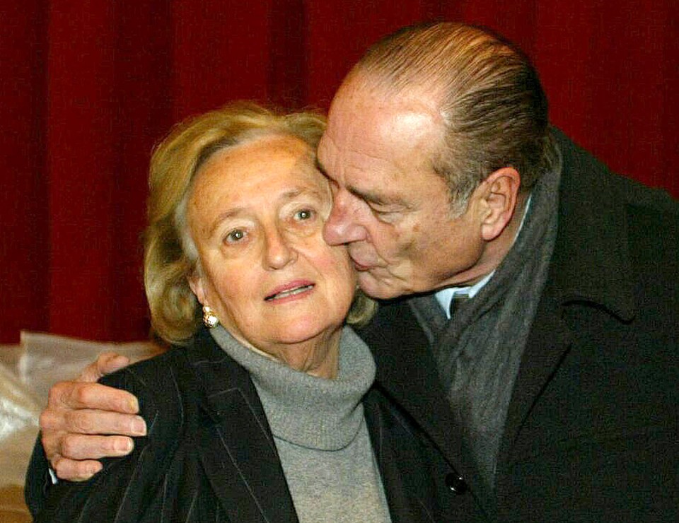 Chirac kisses his wife Bernadette after her victory in regional polls in 2014