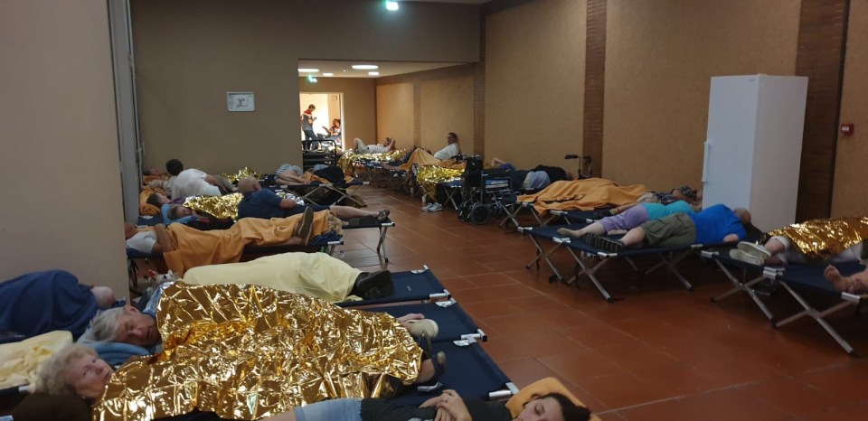 Passengers were given makeshift beds to sleep on after being told they couldn't return to their cruise ship