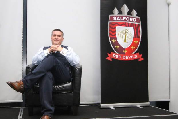 Salford Red Devils director Paul King sitting in a chair.