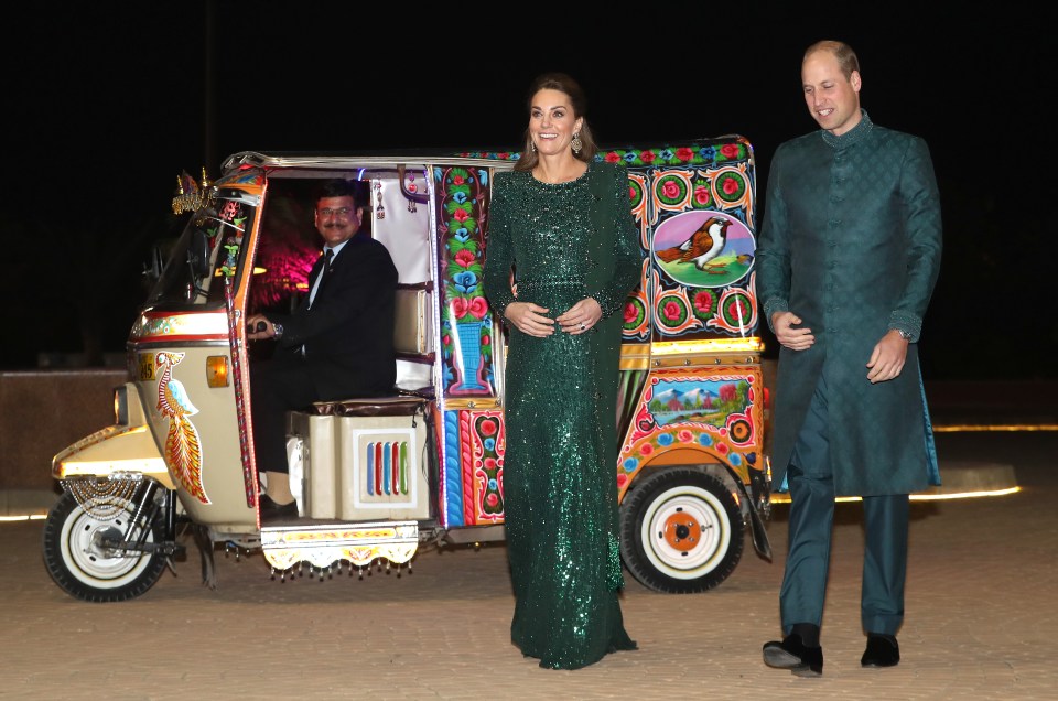 Prince William, the Duke of Cambridge and Catherine, the Duchess of Cambridge arriving at a reception hosted by the British High Commissioner in a rickshaw