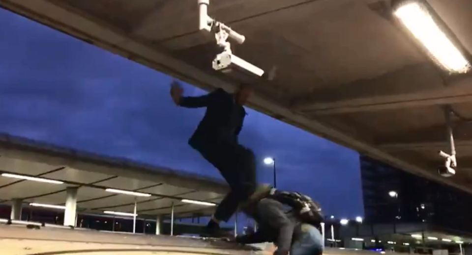  One commuter jumped up and dragged a protester from the train as the crowd cheered